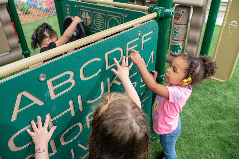 Children playing on a playground at a daycare