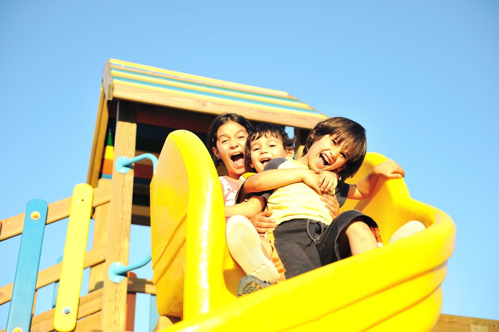 Kids playing on slide